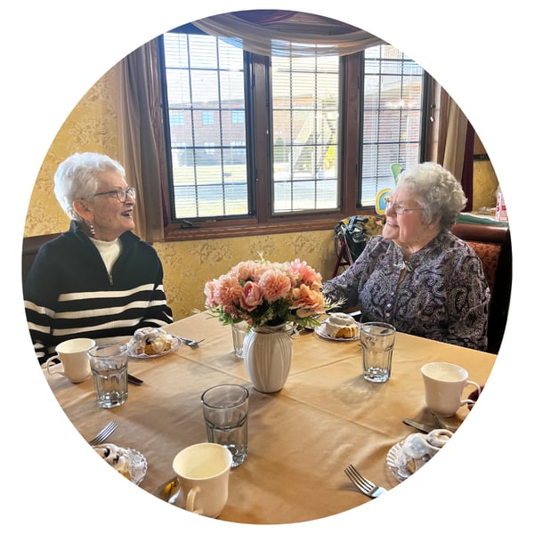 Two women seated at a table